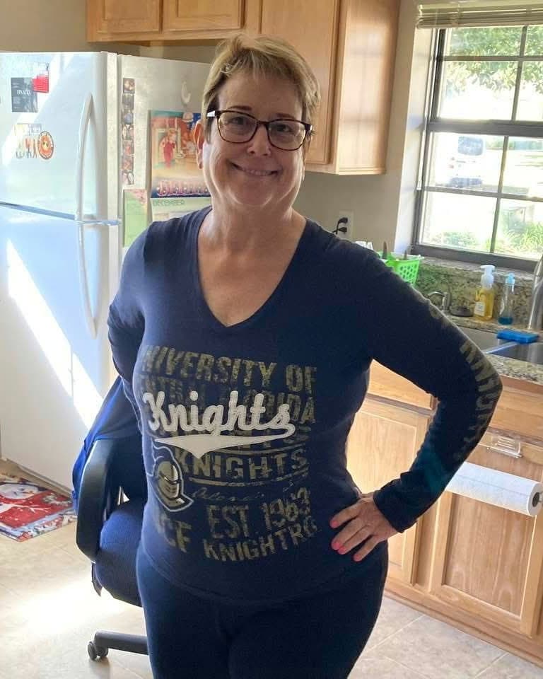 Jan today, standing in her kitchen with her hands on her hips